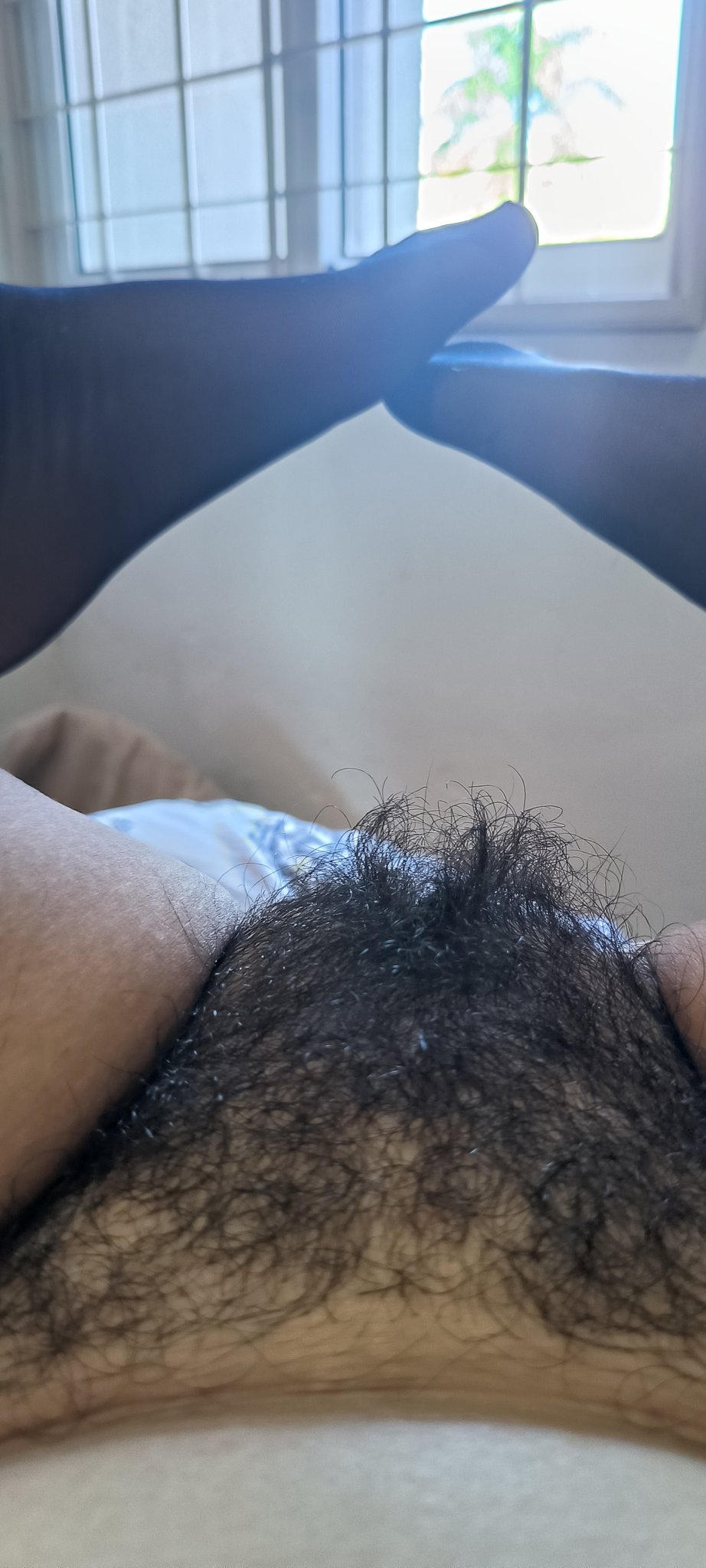 Showing her Hairy pussy