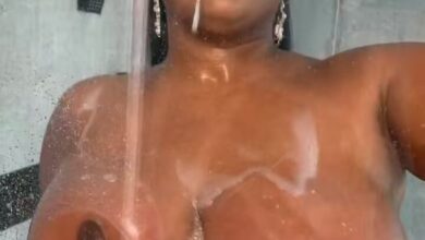 rubbing her boobs