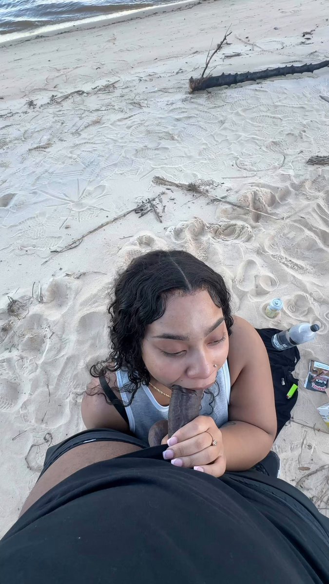 Sucking his dick at the beach
